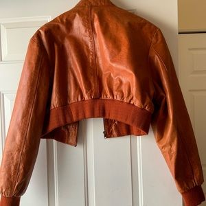 Copper Orange half length leather jacket.